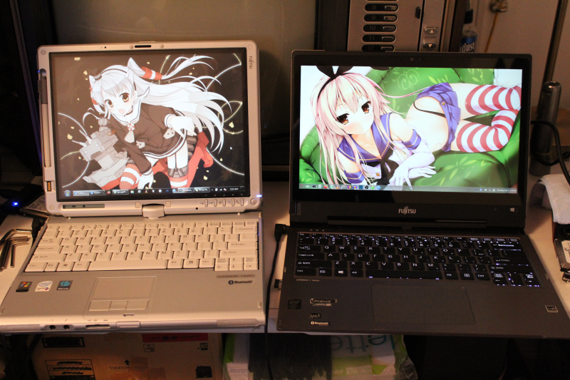 My Fujitsu Lifebook T4210 (left) and her younger sister T904 (right), with very apt wallpapers